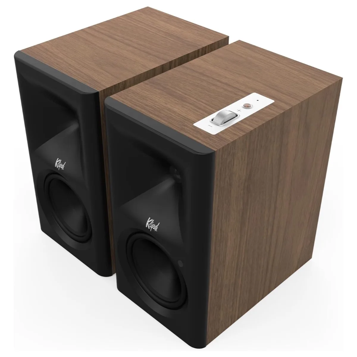 Klipsch The Fives II powered speaker pair in walnut veneer, shown at a three-quarter angle with the top-mounted metal volume wheel visible