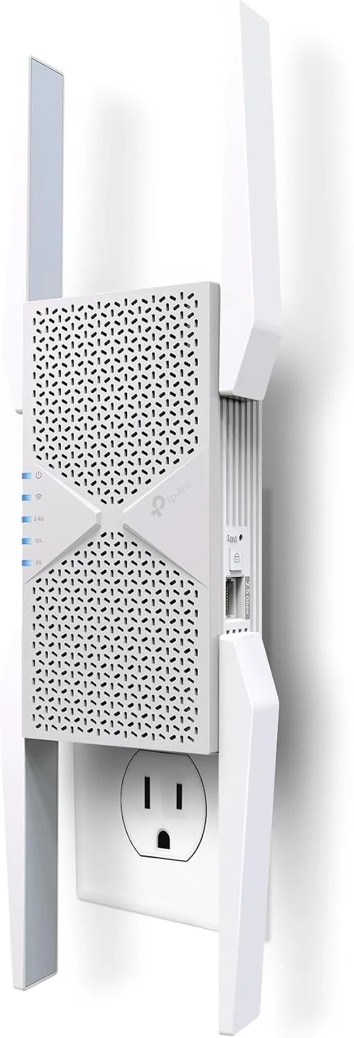 The TP-Link RE653BE wall-plug Wi-Fi 7 range extender in white, photographed against a white background plugged into the upper socket of a US duplex outlet, with four external antennas raised and a vertical strip of status LEDs labelled power, Wi-Fi, 2.4G, 5G and 6G, plus the single 2.5 Gbps Ethernet port and Reset button on its right edge